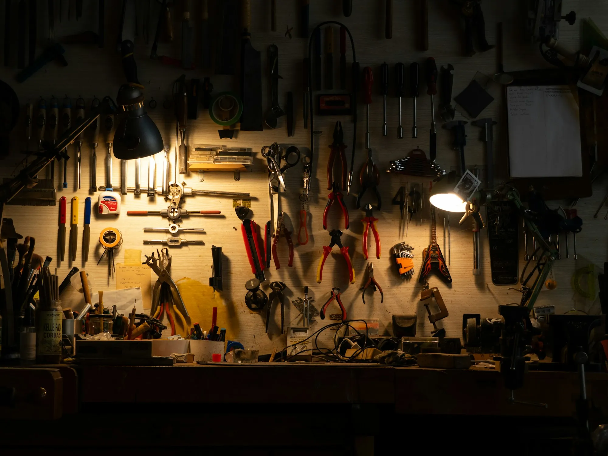 Written job scope and measuring tools laid out on a workbench