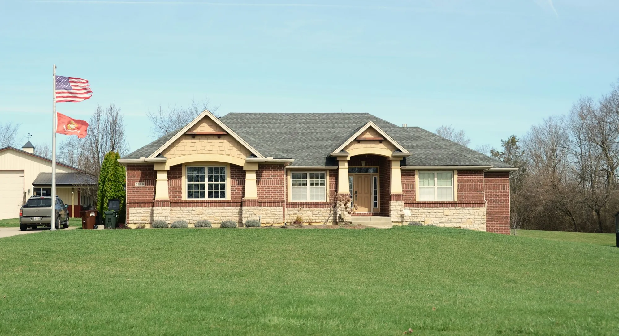 Contemporary brick house with a broad green lawn
