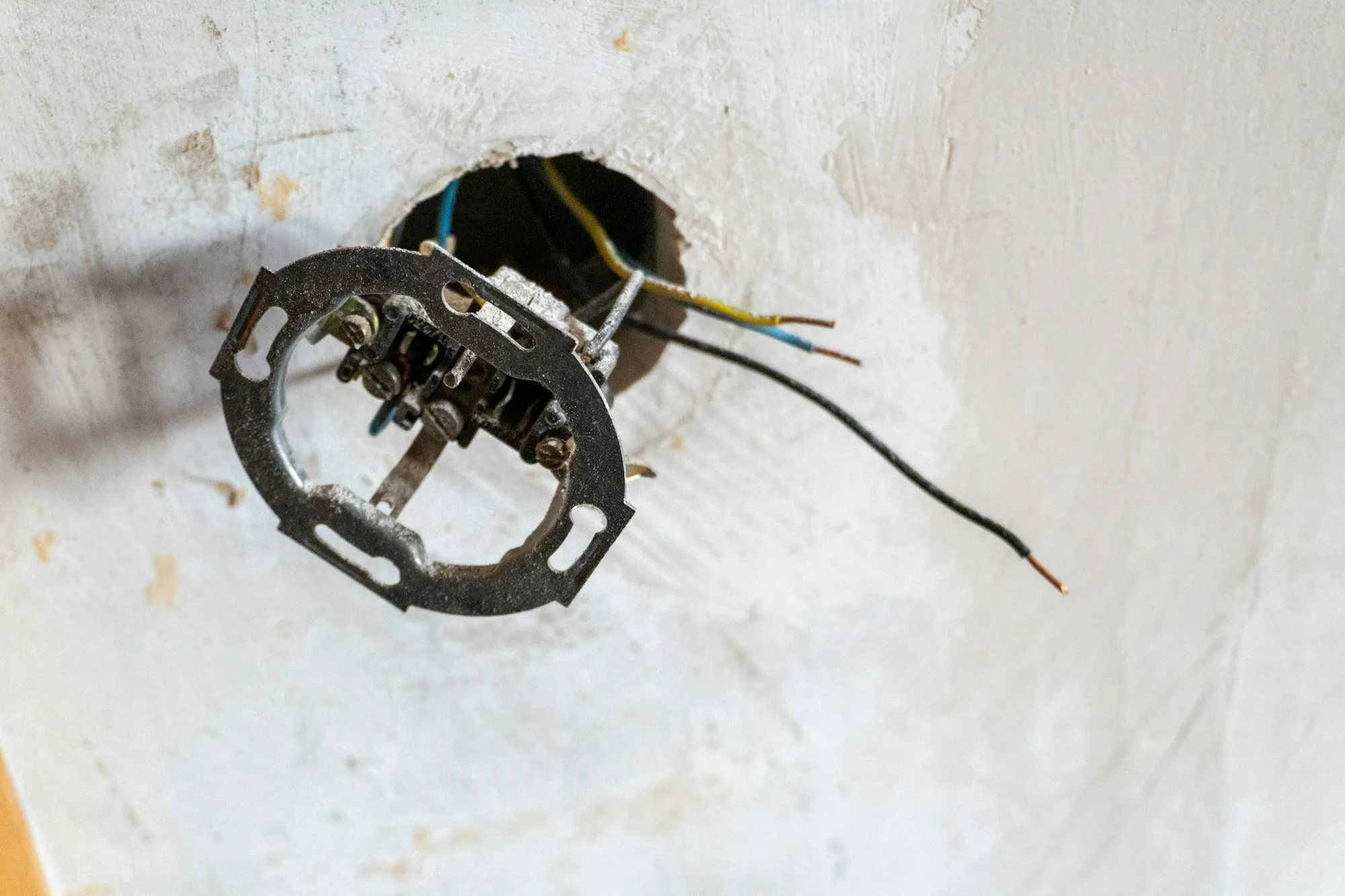 Electrician photographing the interior of a service panel for a report